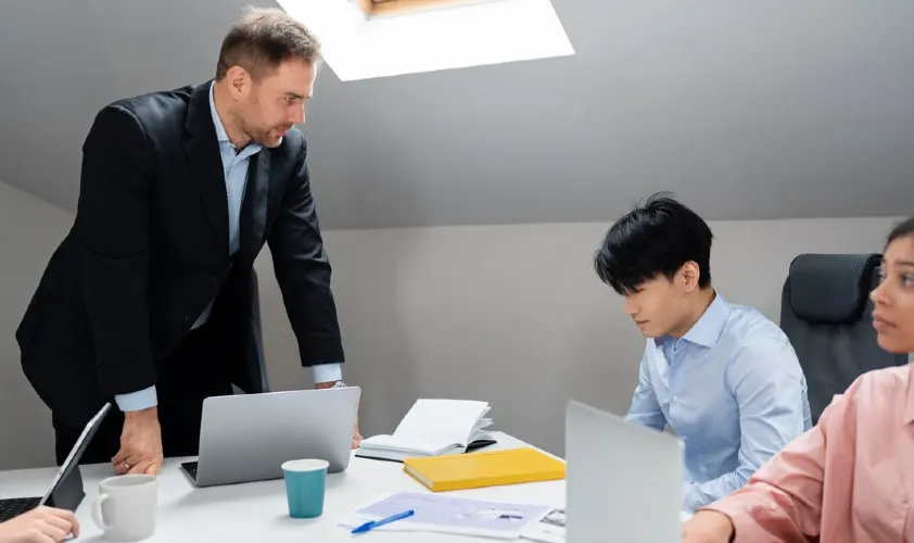 Manager is talking with team members