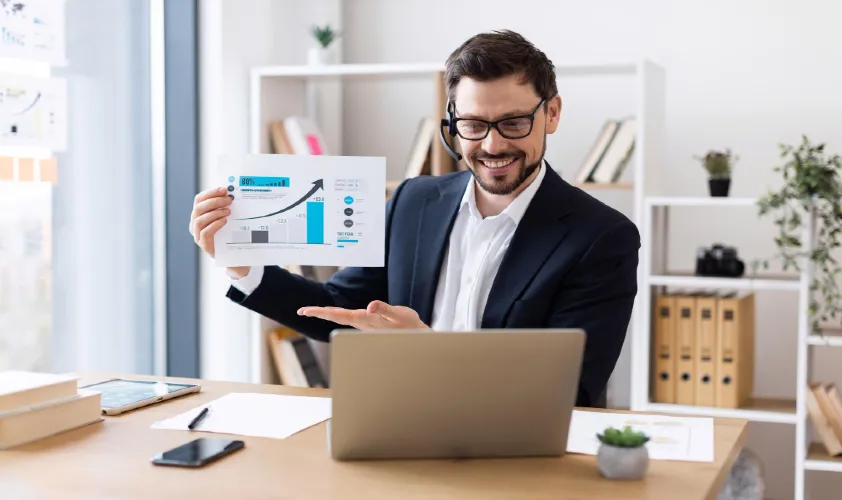 Young man presenting data charts during virtual business meeting professional remote