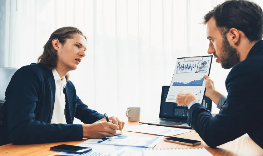 Busy analyst team in office analysing financial data analysis entity
